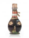 A bottle of Charles Jacquin’s Four Compartment Liqueur Bottle - 1950s