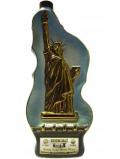 A bottle of Jim Beam Statue Of Liberty Ceramic Bottle