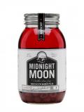 A bottle of Junior Johnson's Midnight Moon Raspberry Moonshine American Whiskey