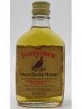 A bottle of Famous Grouse Finest Scotch Miniature