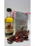 A bottle of Famous Grouse Miniature Thorntons Milk Chocolates Gift Set