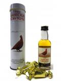 A bottle of Famous Grouse Miniature Treacle Toffees Gift Tin