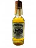 A bottle of Whisky Liqueurs Southern Comfort Miniature Vintage