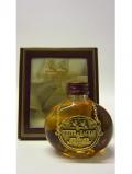 A bottle of Whyte Mackay Scotch Miniature 21 Year Old