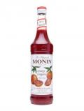 A bottle of Monin Blood Orange Syrup