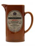 A bottle of Knockando 1975 / Brown Water Jug