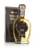 A bottle of Weber Haus Gold Cachaça