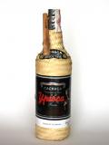 A bottle of Ypioca Prata Empalhada Cachaça / 2 Year Old